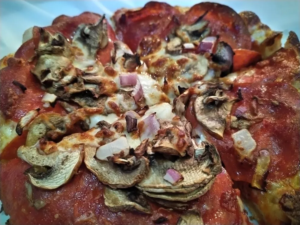 Personal Pan Pizza with Cheese Pepperoni Onions and Mushrooms